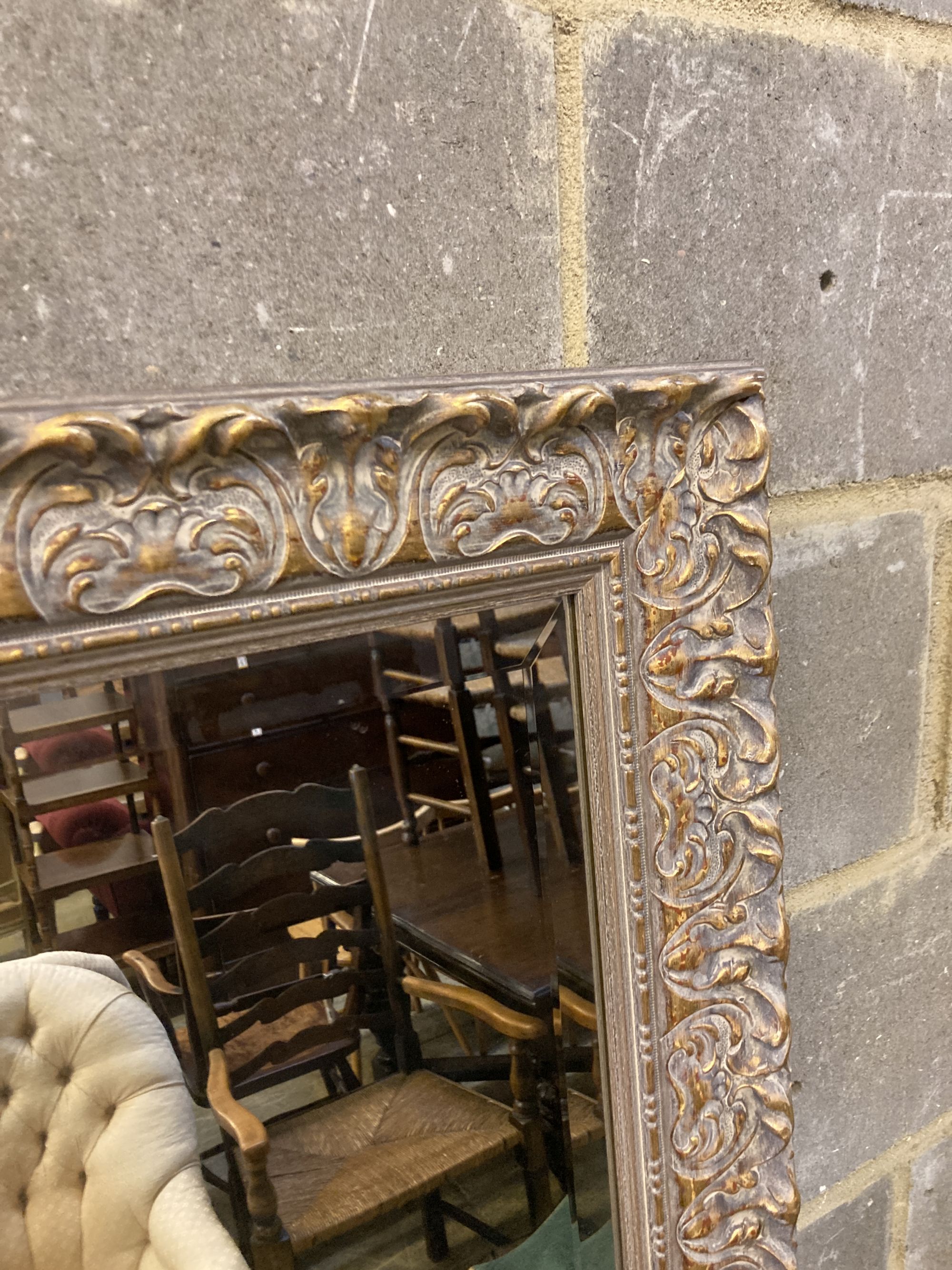 A reproduction rectangular parcel gilt wall mirror, width 70cm, height 168cm